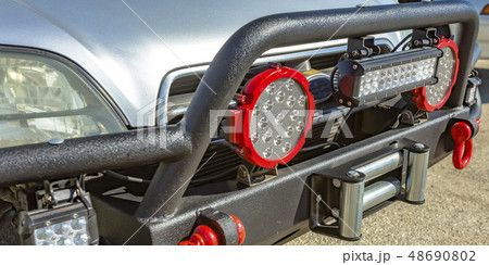 SUV with spotlights and tow hook on grille guard 48690802