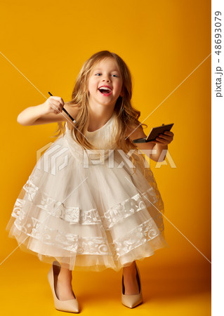 girl with mirror lips and mother's shoes with high heels girl with mirror lips and mother's shoes with high heels 48693079