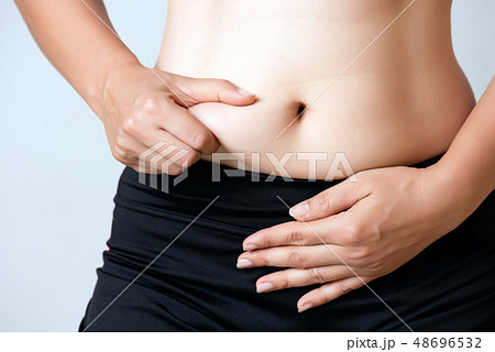 Fat woman hand holding excessive belly fat Fat woman hand holding excessive belly fat 48696532