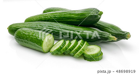 Fresh cucumber with slices isolated on white Fresh cucumber with slices isolated on white 48698919