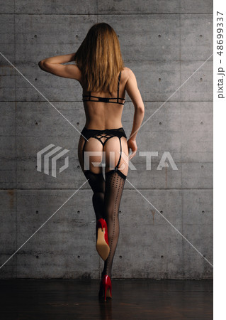 Back view of beautiful woman in black lingerie Back view of beautiful woman in black lingerie 48699337