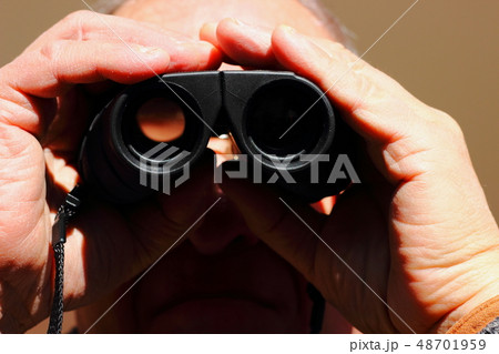 Man looking at his nephew playing soccer. 48701959