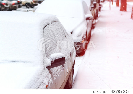 Snow on cars after snowfall 48705035
