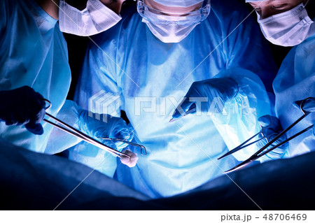 Group of surgeons in masks performing operation. Medicine, surgery and emergency help concepts 48706469