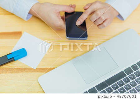 Top view of a shot from the hands of a person with the help of a smartphone in the interior, rear 48707601