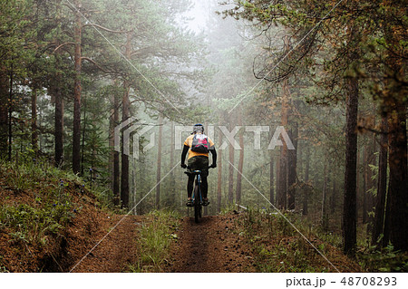 cyclist with backpack riding cyclist with backpack riding 48708293