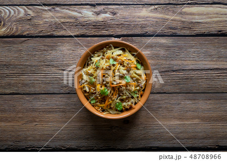 Braised cabbage with carrots and lentils. Braised cabbage with carrots and lentils. 48708966