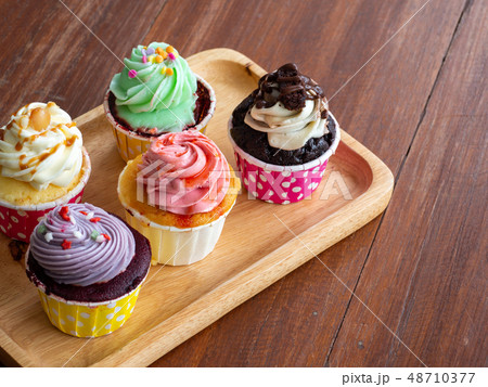 Colorful of homemade cupcake in wooden Tray on 48710377