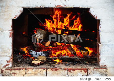 logs are burning in the stove logs are burning in the stove 48711299