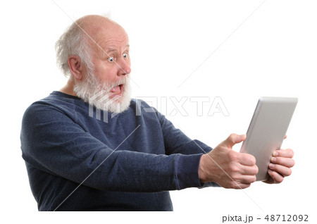 Funny shocked senior man using tablet computer isolated on white 48712092