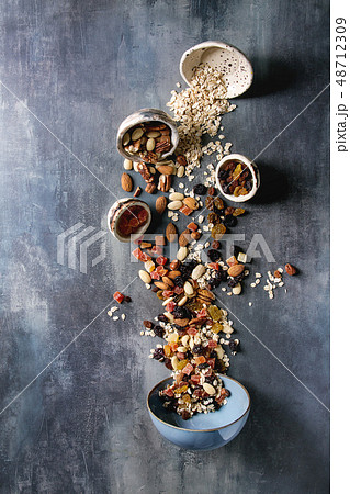 Variety of dried fruits and nuts 48712309