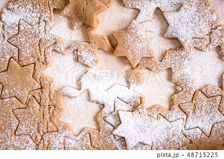 Cutting gingerbread cookies. Process of baking cookies at home. 48715225