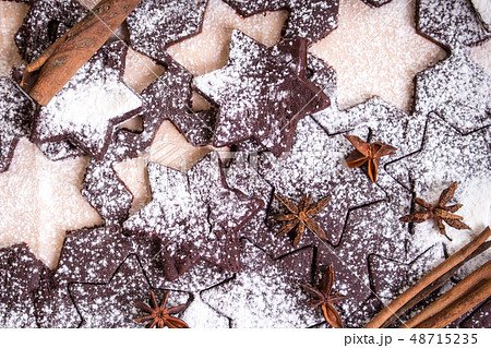 Cutting gingerbread cookies. Process of baking cookies at home. Cutting gingerbread cookies. Process of baking cookies at home. 48715235