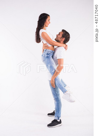Passionate couple dancing social danse kizomba or bachata or semba or taraxia on white background Passionate couple dancing social danse kizomba or bachata or semba or taraxia on white background 48717040