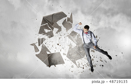 Man destructing recycle symbol 48719135
