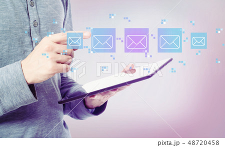 Emails with man holding a tablet 48720458