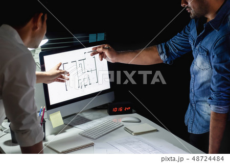 Architect team discussing project at night 48724484