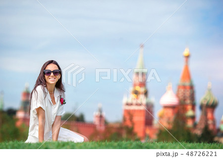 Happy young urban woman in european city. 48726221