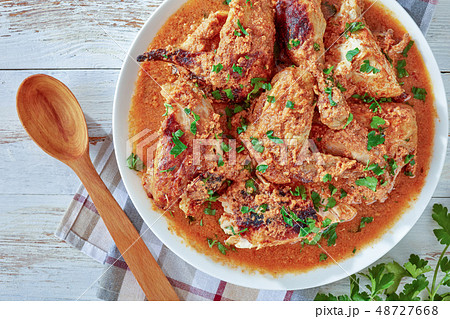 chargrilled Chicken stewed in Coconut milk gravy 48727668