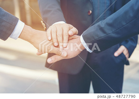 Close up hands teamwork businessman  48727790