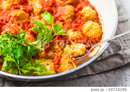 Baked vegan bean meatballs in tomato sauce 48728290