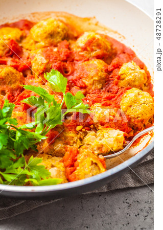 Baked vegan bean meatballs in tomato sauce 48728291