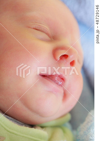 Little newborn baby sleeping calmly in blanket Little newborn baby sleeping calmly in blanket 48729146