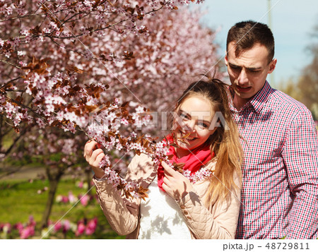 Couple in love walking in park at sunny spring day Couple in love walking in park at sunny spring day 48729811