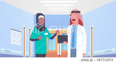 arab doctor and african arabic nurse medical team discussing in hospital corridor healthcare concept 48731854