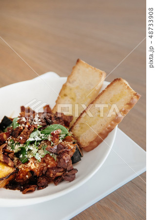 Baked eggplant Aubergine with crispy bacon and 48733908