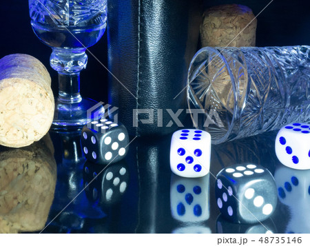 Table gambling with dice in the evening with dim light on a dark background. 48735146