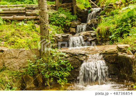 Waterfalls in summertime Waterfalls in summertime 48736854