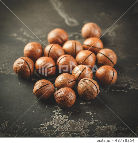 Macadamia nuts on wooden table Macadamia nuts on wooden table 48738254