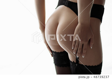 Girl with a naked ass in a corset 48739237