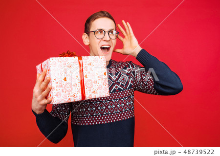 A man with glasses, a stunned guy with a gift A man with glasses, a stunned guy with a gift 48739522