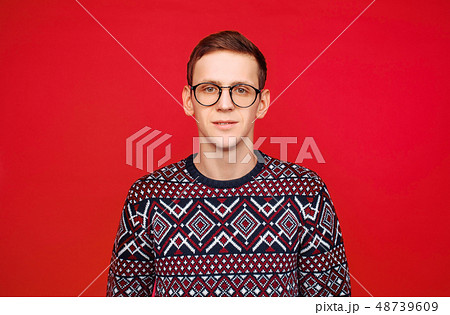 Portrait of a man with glasses and a sweater Portrait of a man with glasses and a sweater 48739609