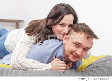 Two lovers are resting on the bed Two lovers are resting on the bed 48740092