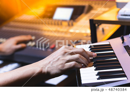 composer hands recording keyboard in home studio composer hands recording keyboard in home studio 48740384