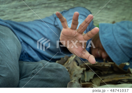 selective focus of Homeless dirty hand in selective focus of Homeless dirty hand in 48741037