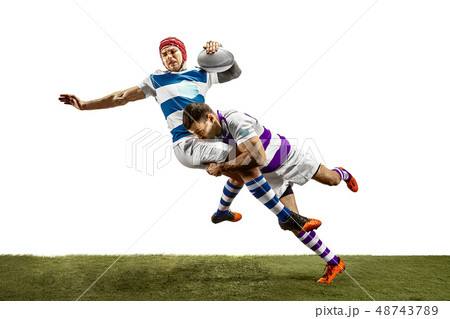 The silhouette of two caucasian rugby male players isolated on white background The silhouette of two caucasian rugby male players isolated on white background 48743789