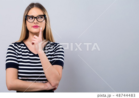 Young woman in a thoughtful pose 48744483