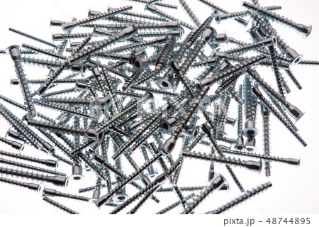 Mound of furniture screws top view on white 48744895