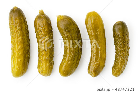 Set of pickled cucumbers of different shapes on a 48747321