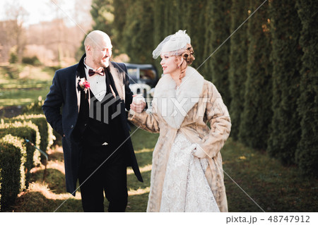 Sensual portrait of a young wedding couple. Outdoor 48747912