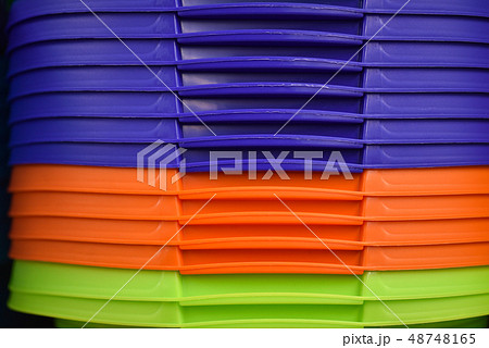 Colored plastic baskets for housewives in store Colored plastic baskets for housewives in store 48748165