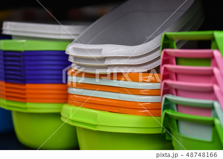 Colored plastic baskets for housewives in store Colored plastic baskets for housewives in store 48748166