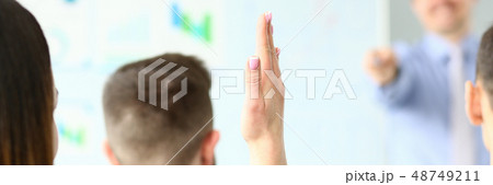 Female hand is raised up in hall for an 48749211