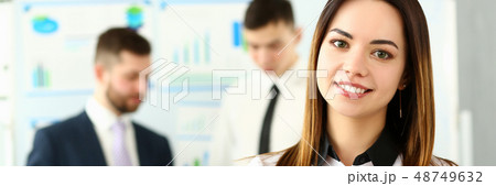 Beautiful smiling brunette clerk girl at workplace 48749632