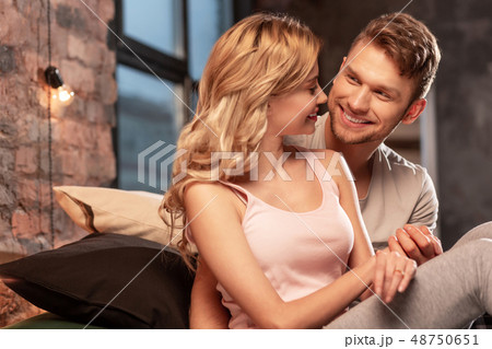 Lovely just married couple enjoying time together in the bedroom Lovely just married couple enjoying time together in the bedroom 48750651