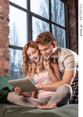 Girlfriend watching movie on tablet with her handsome man 48750751